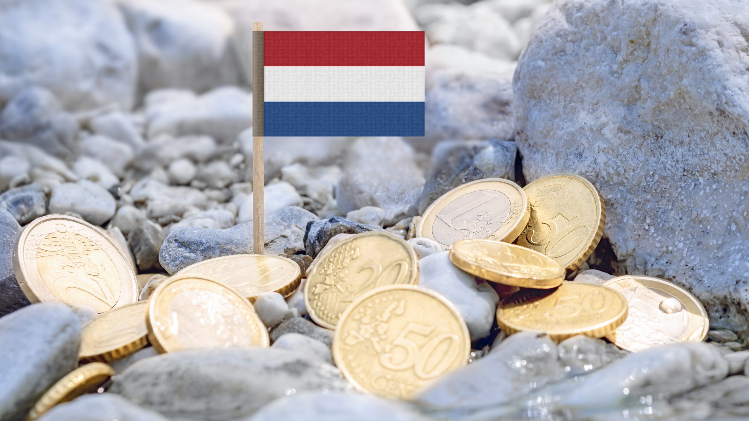 Dutch flag surrounded by euro coins, illustrating loans for expats in the Netherlands
